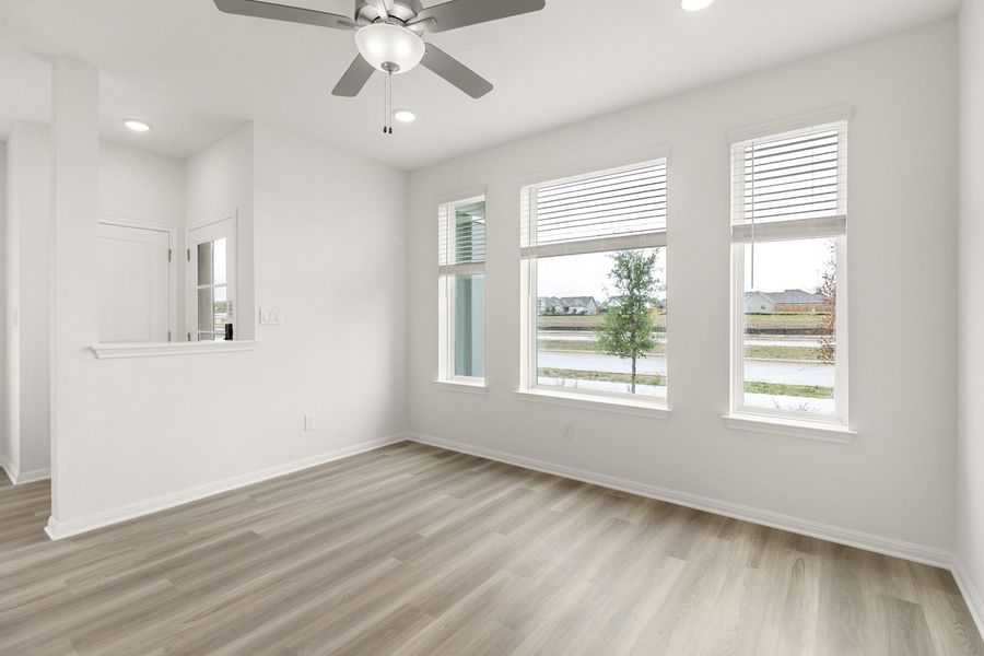 Unfurnished room featuring ceiling fan, light wood-type flooring, and recessed lighting