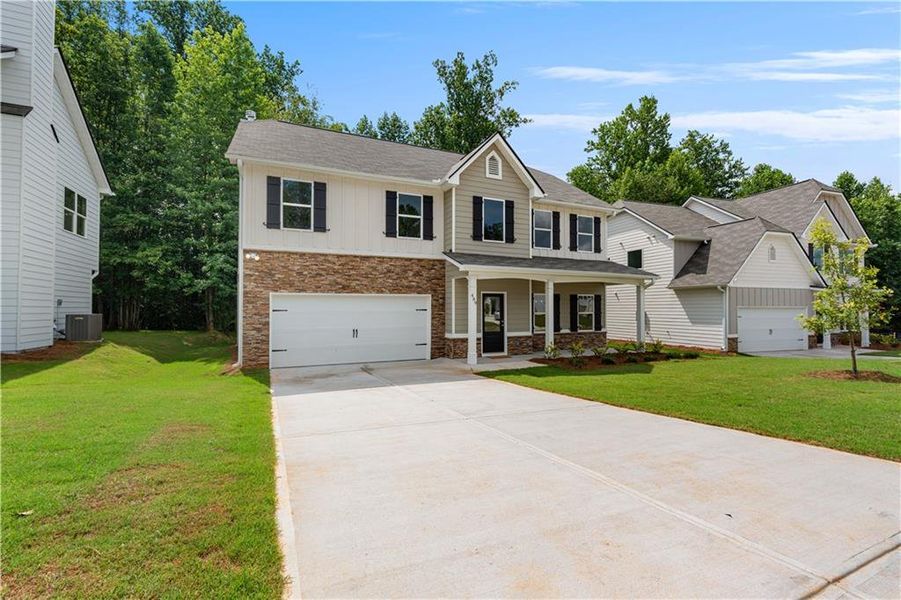Front exterior of a new home in , Villa Rica, GA, highlighting curb appeal (Image 19). Front exterior of a new home in , Villa Rica, GA, highlighting curb appeal (Image 19).