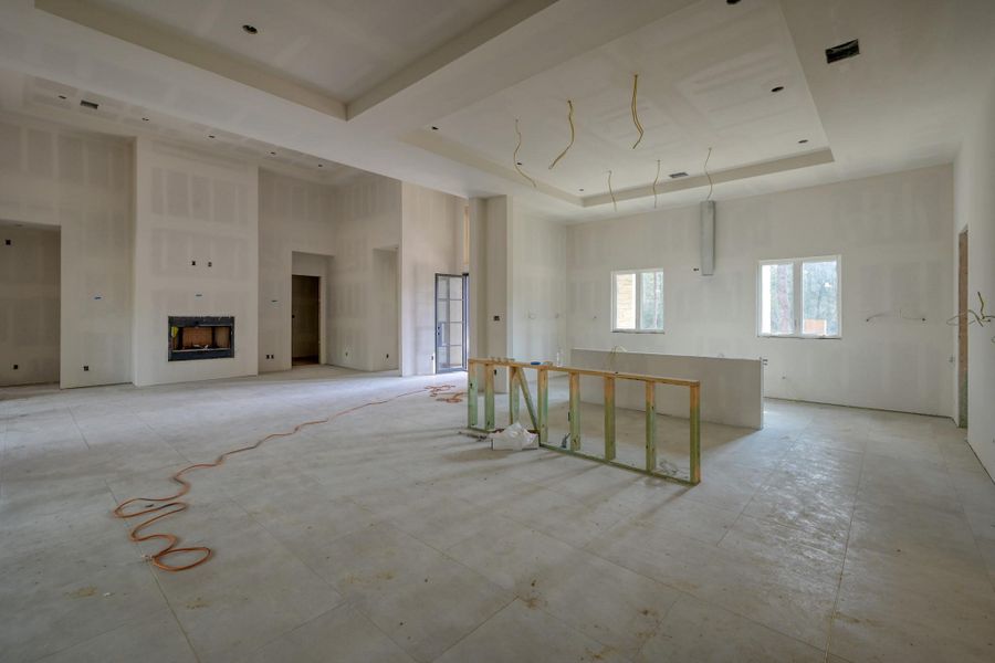 This chef’s kitchen blends elevated design with exceptional functionality, featuring premium Café™ appliances, two oversized islands, and finishes inspired by the surrounding landscape. Custom European cabinetry with integrated LED accent lighting creates a refined aesthetic, complemented by a large stainless steel sink ideal for everyday use.