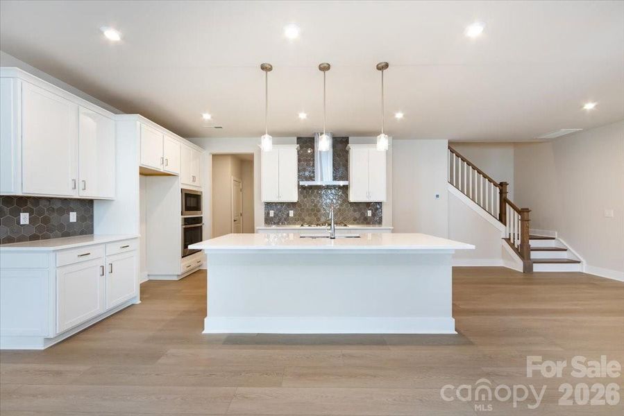 Gourmet Kitchen with Mesmerist Spirit Charm Hex Backsplash