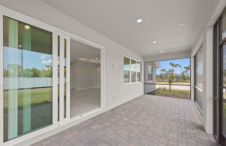 Exterior details and patio area of a home in Shores at Stillwater, Englewood (Image 22).
