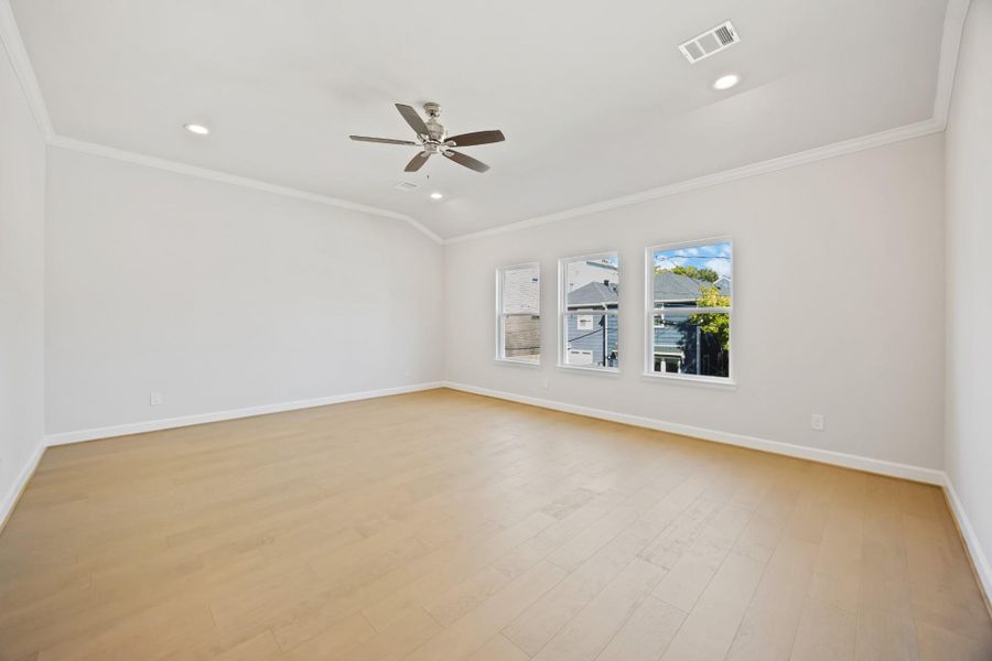 A sanctuary of light and luxury; this large, primary bedroom serves as a haven of tranquility and refined comfort. A sanctuary of light and luxury; this large, primary bedroom serves as a haven of tranquility and refined comfort.