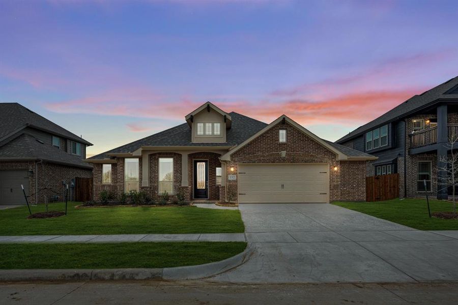 Front exterior of a new home in Hampton Park, Glenn Heights, TX, highlighting curb appeal (Image 2). Front exterior of a new home in Hampton Park, Glenn Heights, TX, highlighting curb appeal (Image 2).