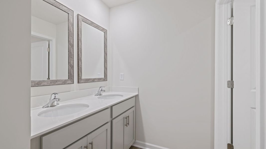 Furnished interior view inside a new home in Bentley Park, Greenwood (Image 11).