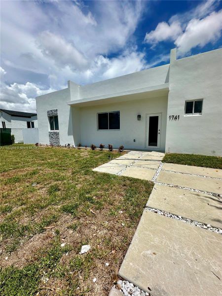 Front exterior of a new home in , Miami, FL, highlighting curb appeal (Image 12). Front exterior of a new home in , Miami, FL, highlighting curb appeal (Image 12).