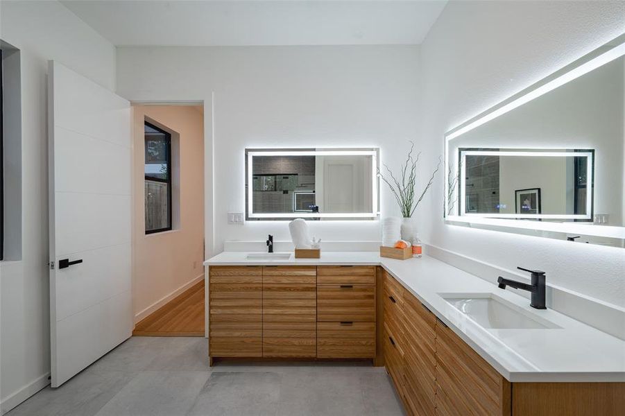 Bathroom with hardwood / wood-style flooring and vanity