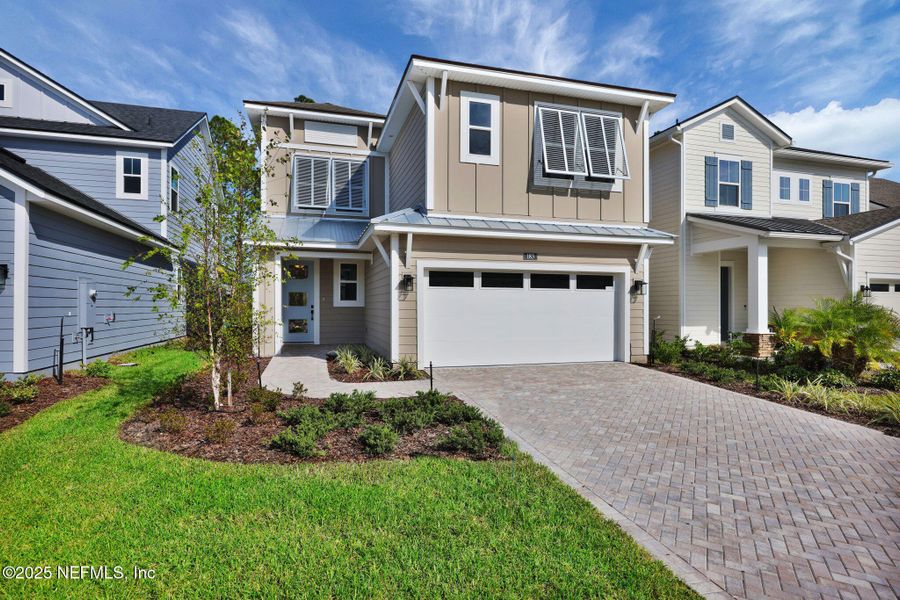 Front exterior of a new home in Crosswinds at Nocatee, Ponte Vedra, FL, highlighting curb appeal (Image 1).