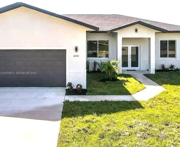Front exterior of a new home in , Lehigh Acres, FL, highlighting curb appeal (Image 1). Front exterior of a new home in , Lehigh Acres, FL, highlighting curb appeal (Image 1).