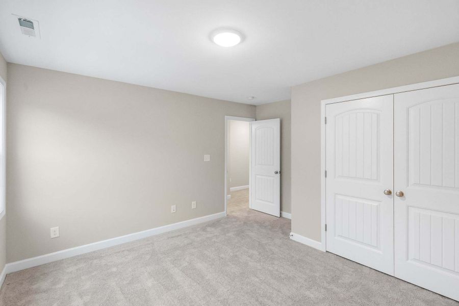 Representative unfurnished interior of a home built from the Aberdeen by Caviness & Cates Communities in Bartlett Manor, Youngsville (Image 202).