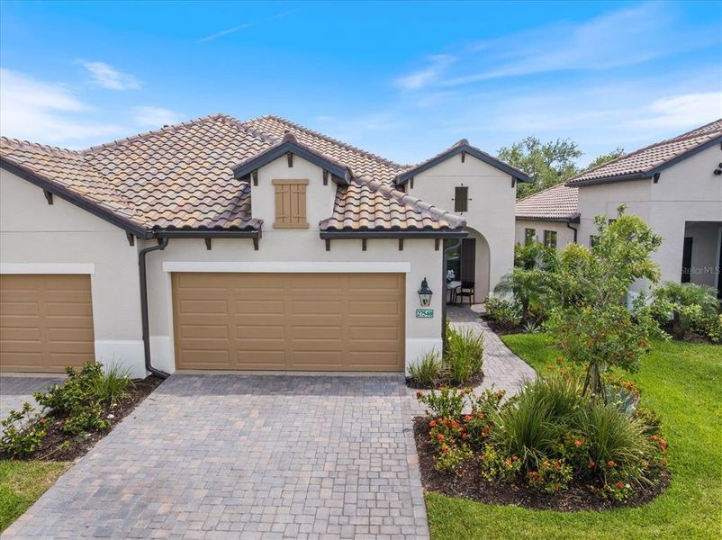 Front exterior of a new home in , Englewood, FL, highlighting curb appeal (Image 19). Front exterior of a new home in , Englewood, FL, highlighting curb appeal (Image 19).