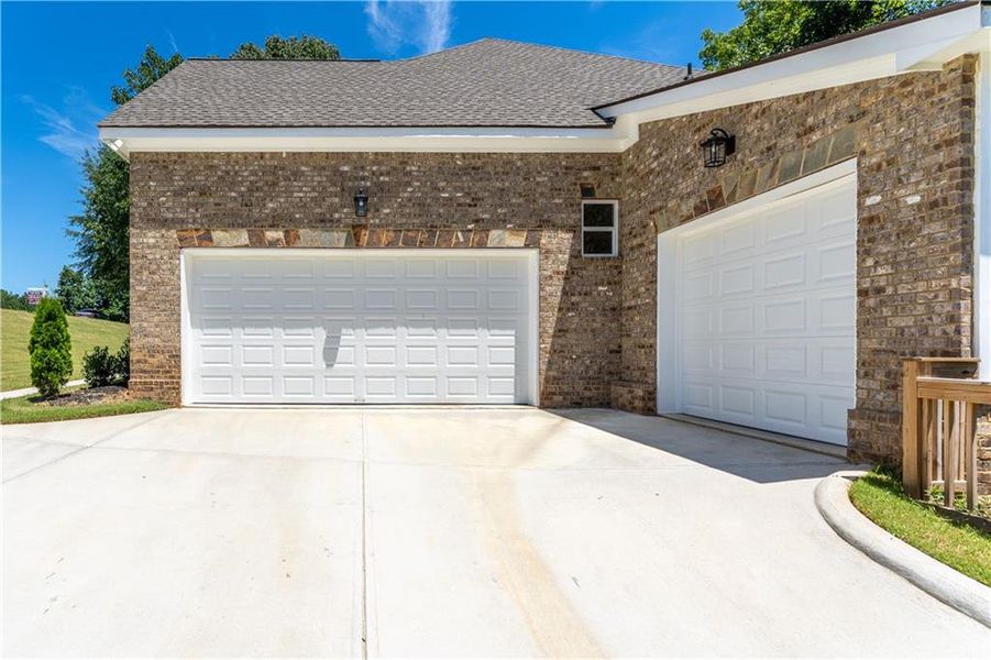 Front exterior of a new home in , Suwanee, GA, highlighting curb appeal (Image 23).