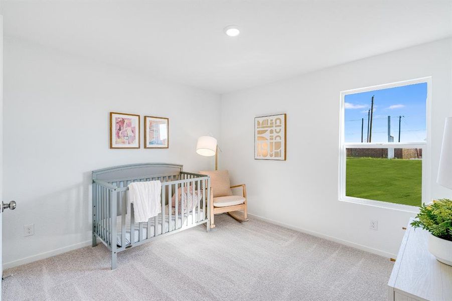 Bedroom featuring a nursery area, carpet, and recessed lighting