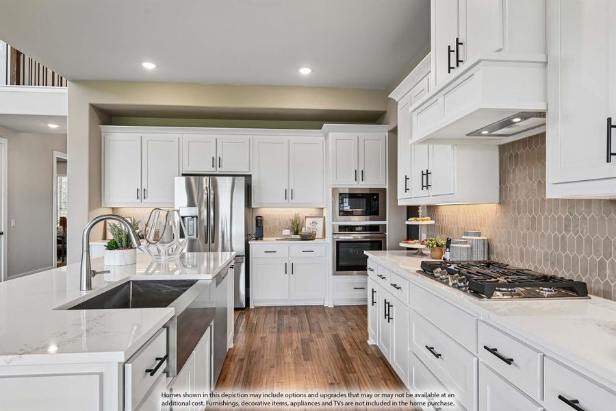 Kitchen with white cabinets, quartz countertops, stainless steel appliances, and decorative tile backsplash Kitchen with white cabinets, quartz countertops, stainless steel appliances, and decorative tile backsplash