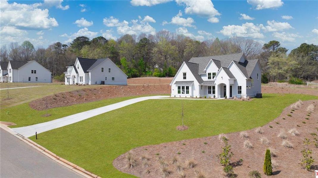 Front exterior of a new home in , Gainesville, GA, highlighting curb appeal (Image 29).