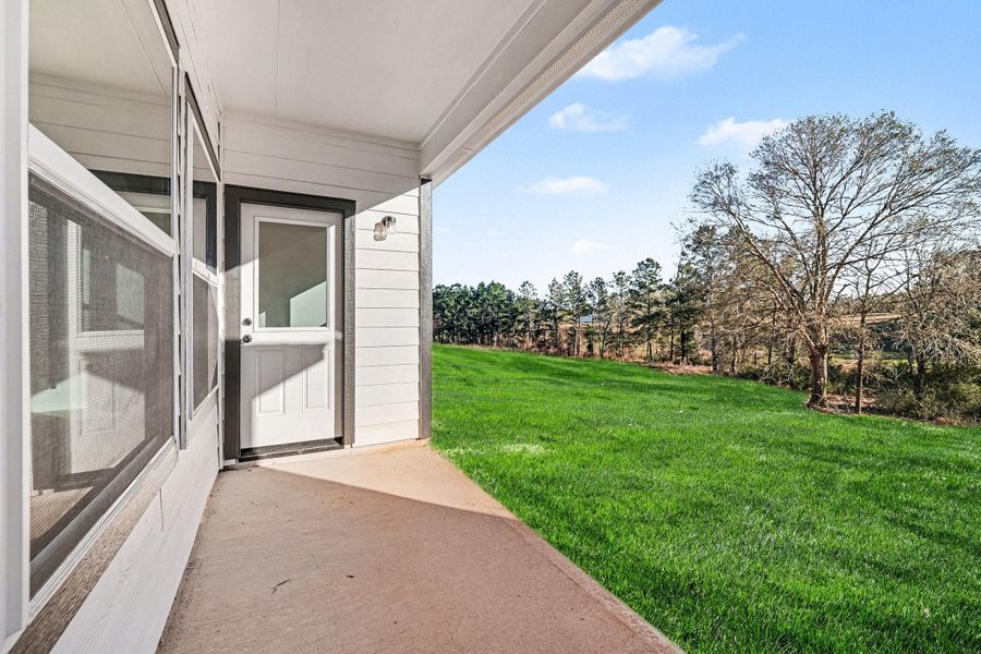 Exterior details and patio area of a home in Rose Hill Estates, Willis (Image 24).