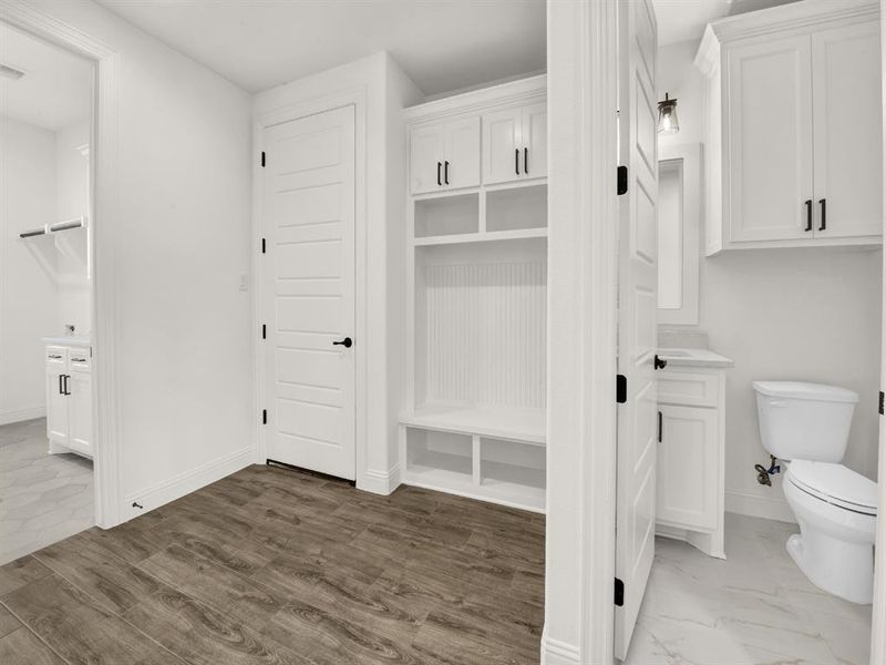 Mudroom with baseboards and wood finished floors Mudroom with baseboards and wood finished floors