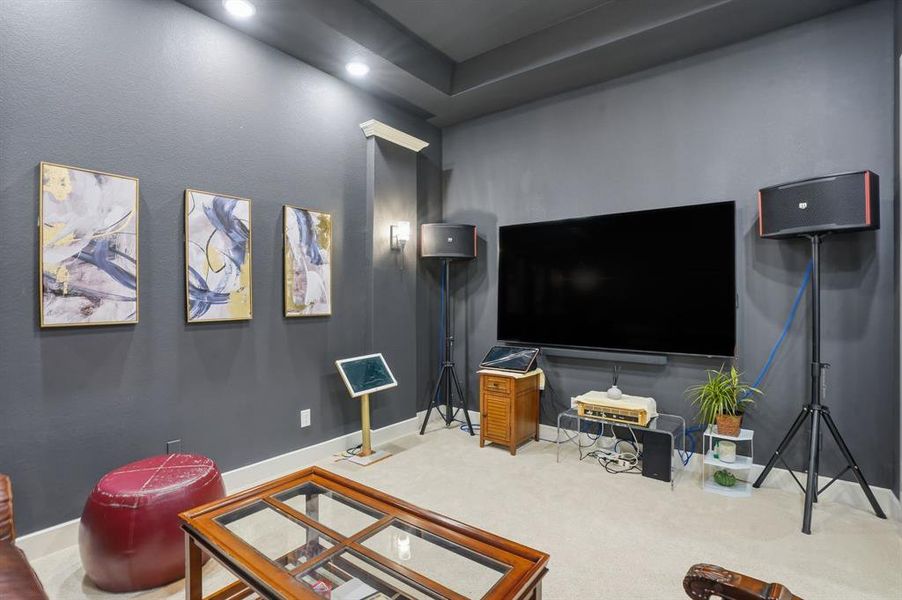 Carpeted living room with baseboards Carpeted living room with baseboards