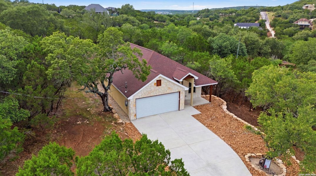 Front exterior of a new home in , Canyon Lake, TX, highlighting curb appeal (Image 2). Front exterior of a new home in , Canyon Lake, TX, highlighting curb appeal (Image 2).