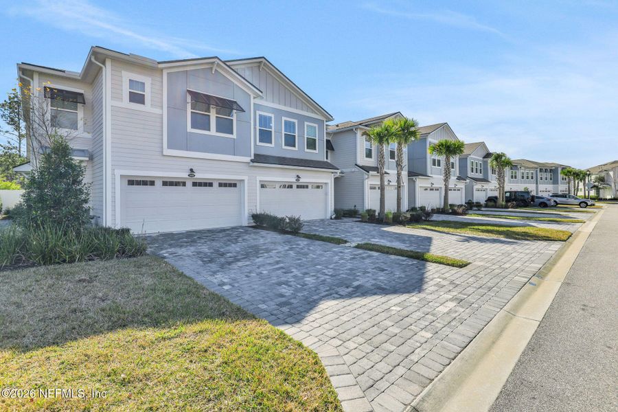 Front exterior of a new home in , Jacksonville, FL, highlighting curb appeal (Image 27).