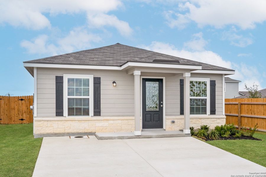 Front exterior of a new home in Blue Wing, San Antonio, TX, highlighting curb appeal (Image 1).