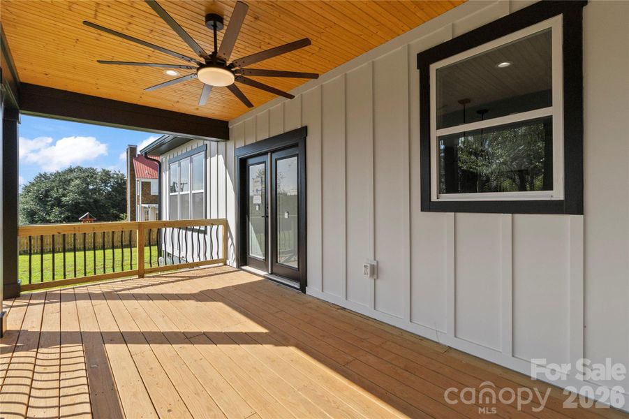 Great view of rear of home. The rear covered deck is beautiful. No septic in back yard so a small pool is a possibility.