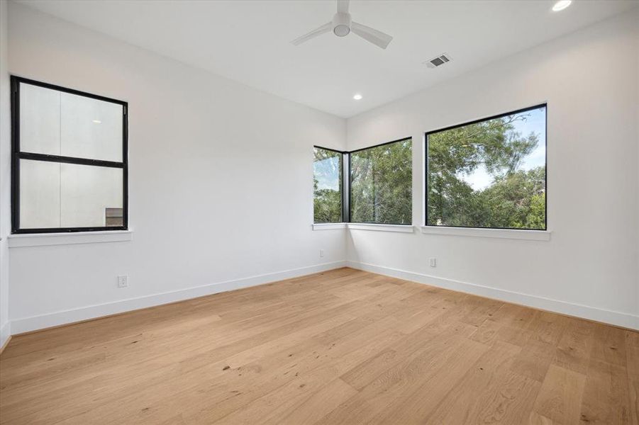 Front bedroom with large corner windows.