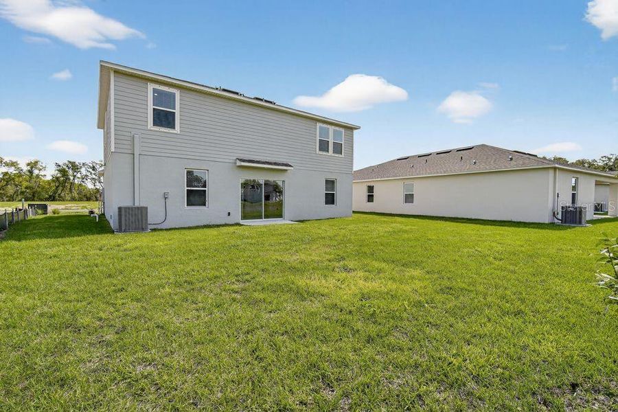 Exterior details and patio area of a home in Palm Wind, Hudson (Image 3).