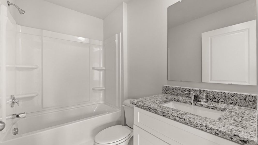 Representative furnished interior of a home built from the Mansfield by D.R. Horton in Highland Hills, Graniteville (Image 10).