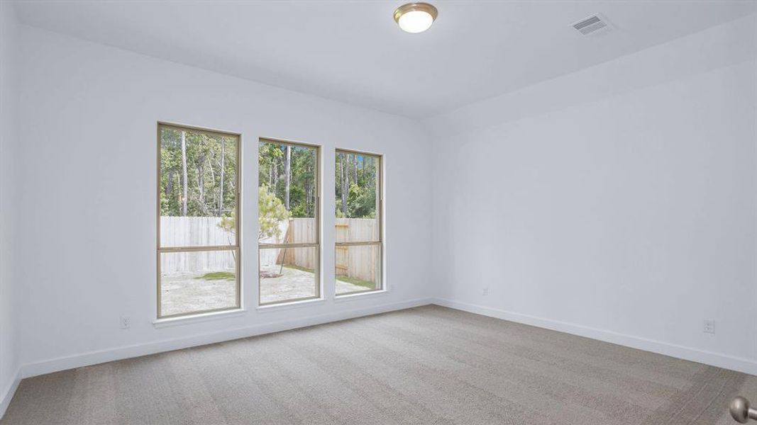 Spacious, unfurnished interior of a new home in Artavia 45', Conroe (Image 9).