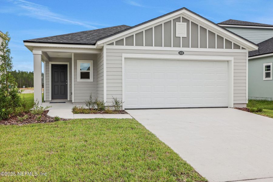 Front exterior of a new home in Bellbrooke, Jacksonville, FL, highlighting curb appeal (Image 16).