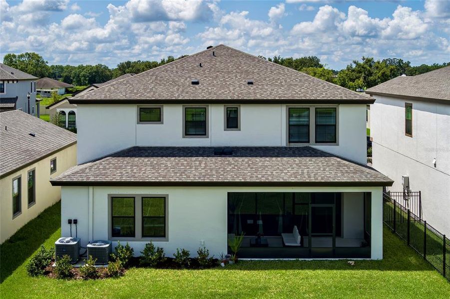Exterior details and patio area of a home in Crosswind Point, Parrish (Image 31).