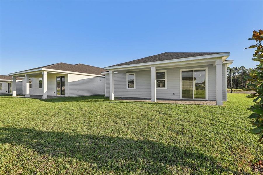 Exterior details and patio area of a home in Colbert Landings, Palm Coast (Image 16).