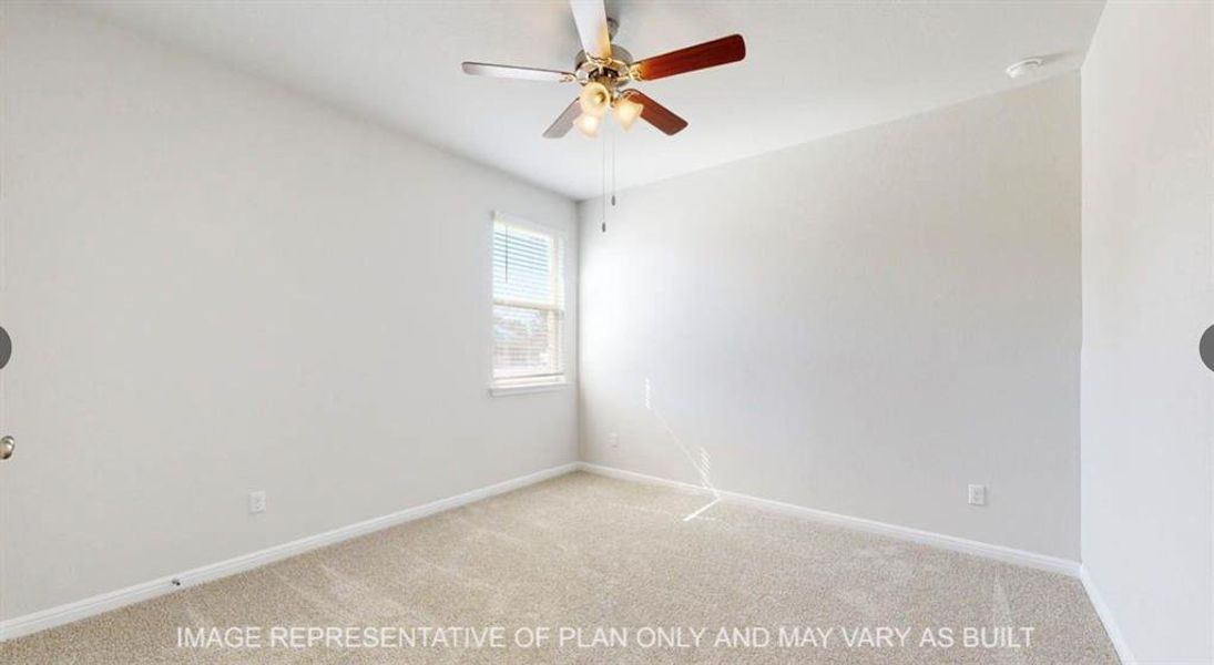 Carpeted empty room featuring baseboards and ceiling fan Carpeted empty room featuring baseboards and ceiling fan