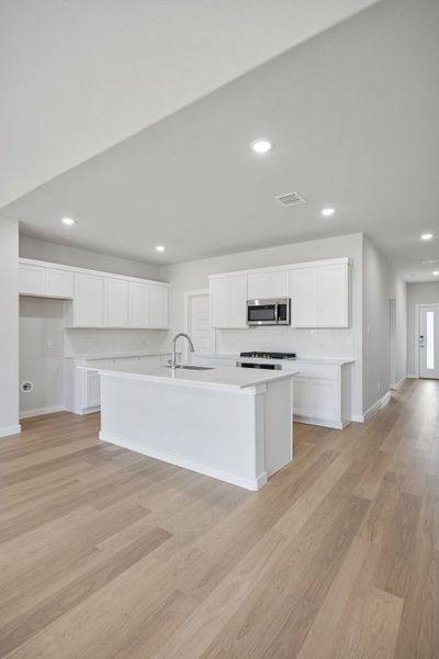 Kitchen in the Masters home plan by Trophy Signature Homes – REPRESENTATIVE PHOTO