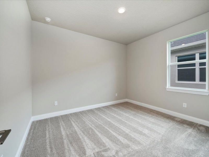 Bedroom in the Onyx floorplan at 6383 NW Sweetwood Drive in Brystol at Wylder