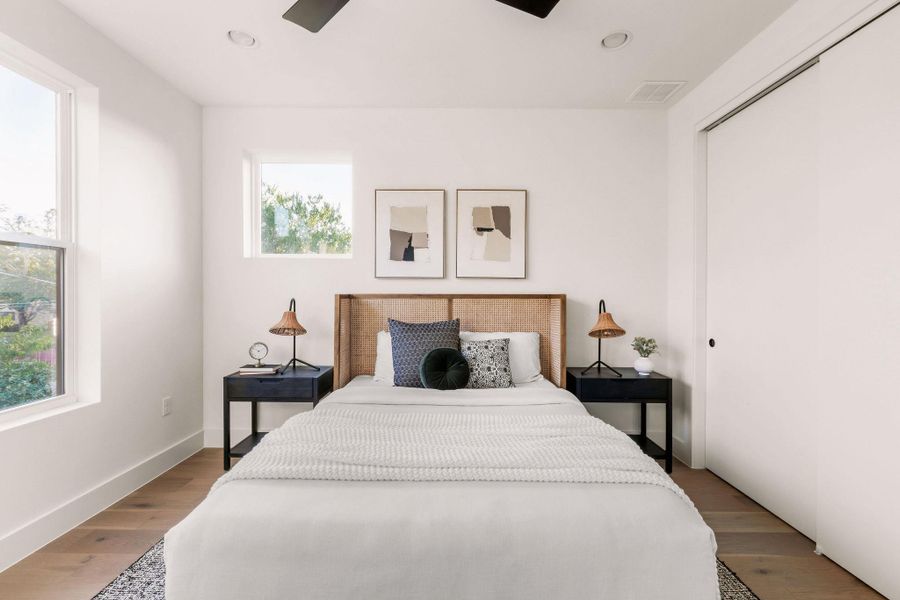 Bedroom featuring a closet, ceiling fan, wood finished floors, and recessed lighting Bedroom featuring a closet, ceiling fan, wood finished floors, and recessed lighting