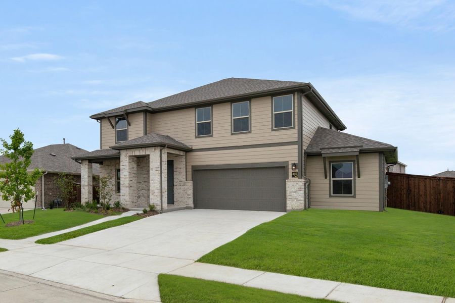 Front exterior of a new home in Waterscape, Royse City, TX, highlighting curb appeal (Image 2). Front exterior of a new home in Waterscape, Royse City, TX, highlighting curb appeal (Image 2).
