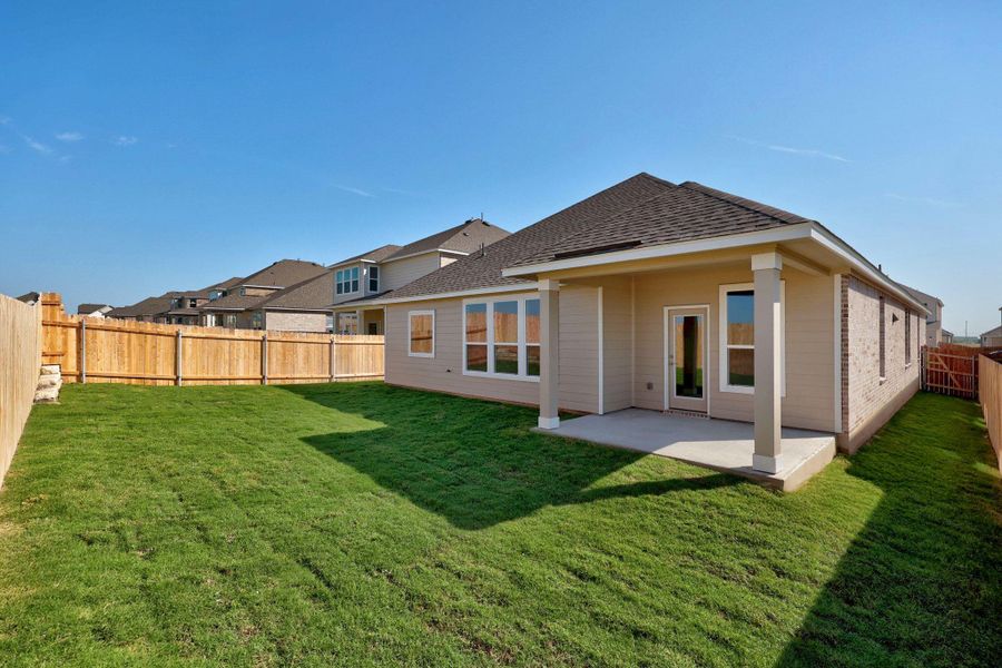 Front exterior of a new home in Salerno - Classic Collection, Round Rock, TX, highlighting curb appeal (Image 15). Front exterior of a new home in Salerno - Classic Collection, Round Rock, TX, highlighting curb appeal (Image 15).