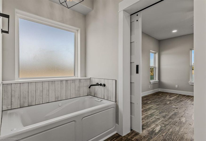 Primary Bathroom with Dual Sinks, Separate Shower and Tub, Lighted Mirror with fog control. The closet is huge with built in safe!!