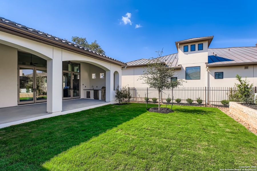 Exterior details and patio area of a home in The Bluff At The Dominion, San Antonio (Image 4).