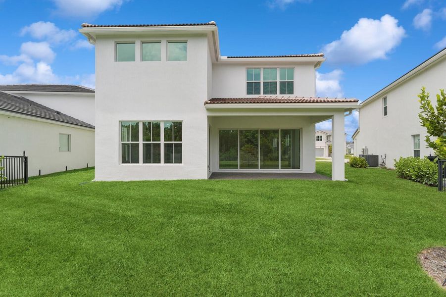 Front exterior of a new home in Salerno Reserve - Single Family, Stuart, FL, highlighting curb appeal (Image 26). Front exterior of a new home in Salerno Reserve - Single Family, Stuart, FL, highlighting curb appeal (Image 26).