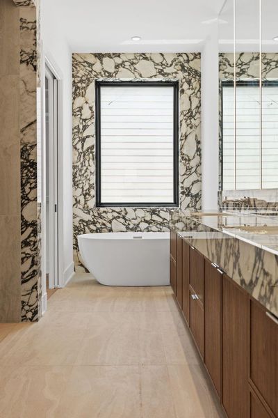 Absolutely breathtaking primary bath with oversized shower, soaking tub and dual vanities.