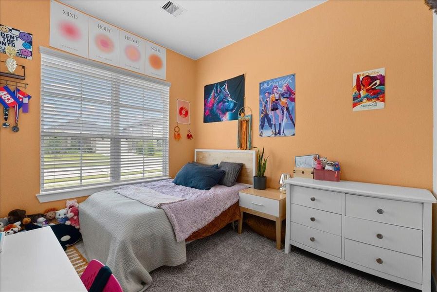 The front bedroom welcomes you with an abundance of natural light from its oversized window, showcasing the spacious layout and inviting feel of the room. The front bedroom welcomes you with an abundance of natural light from its oversized window, showcasing the spacious layout and inviting feel of the room.