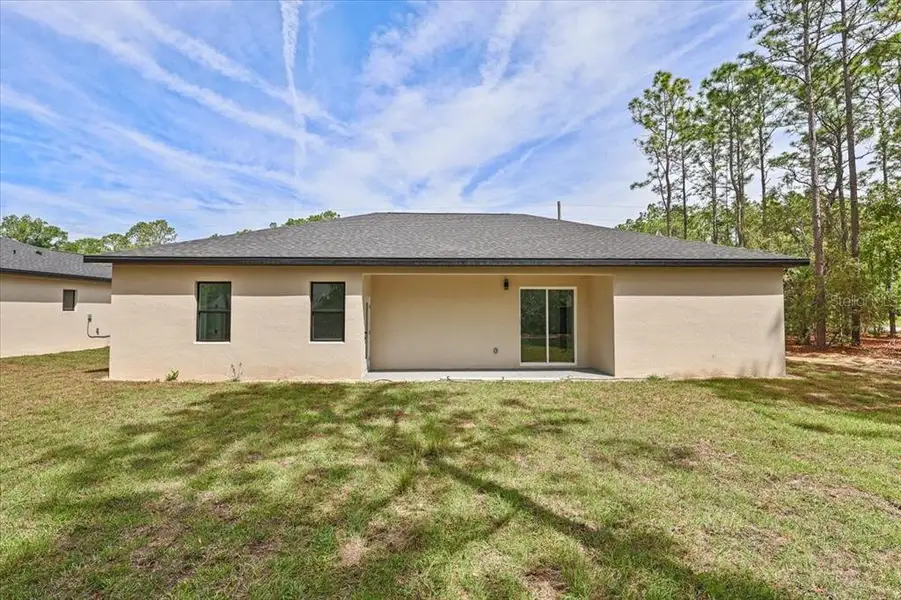 Exterior details and patio area of a home in , Citrus Springs (Image 3).
