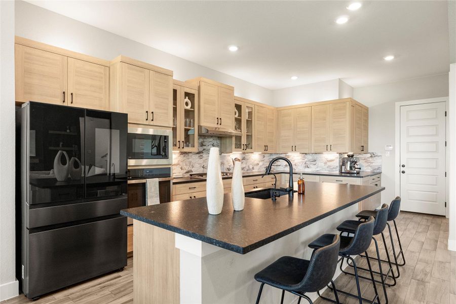 A well-appointed culinary space showcasing modern appliances and extensive cabinetry. A well-appointed culinary space showcasing modern appliances and extensive cabinetry.