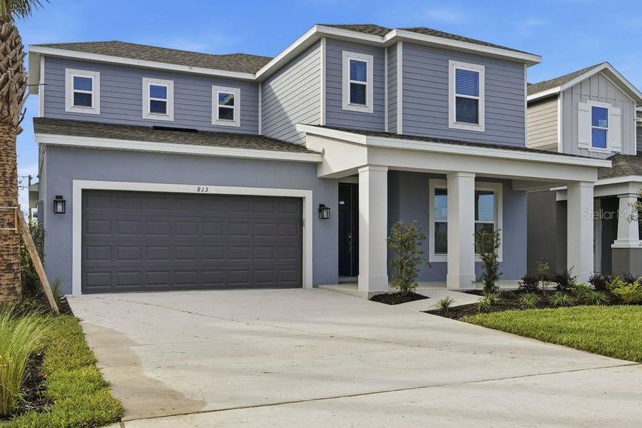 Front exterior of a new home in Indigo Creek, Apollo Beach, FL, highlighting curb appeal (Image 2).