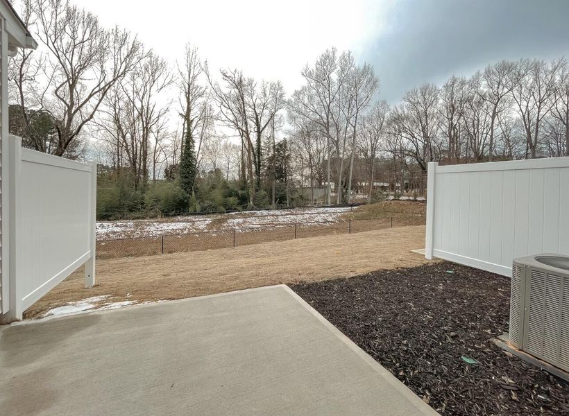 Exterior details and patio area of a home in East Main Townes, Spartanburg (Image 3).