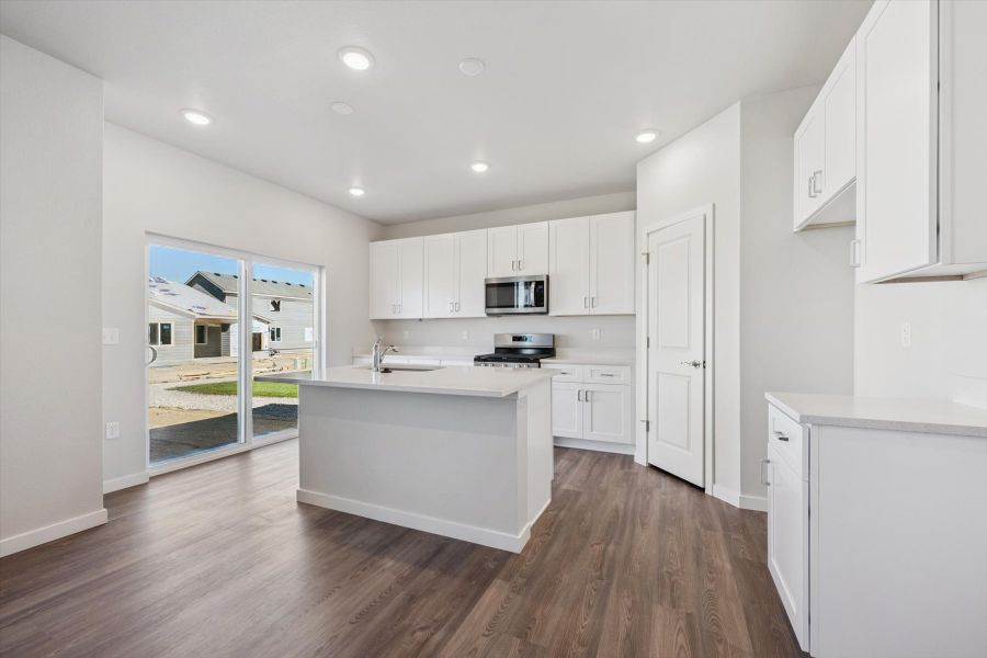 A kitchen with white cabinets. A kitchen with white cabinets.