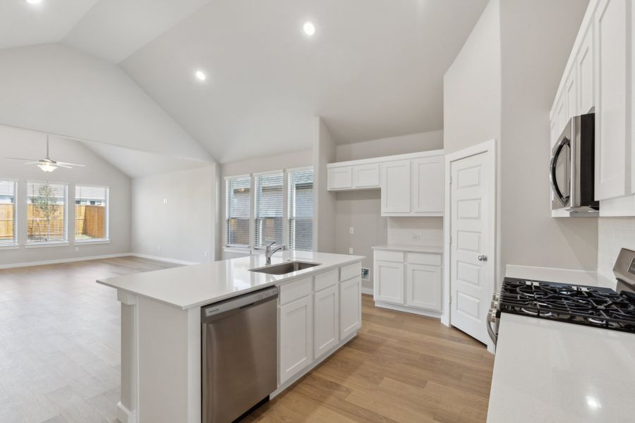 Kitchen in the Claret home plan by Trophy Signature Homes – REPRESENTATIVE PHOTO