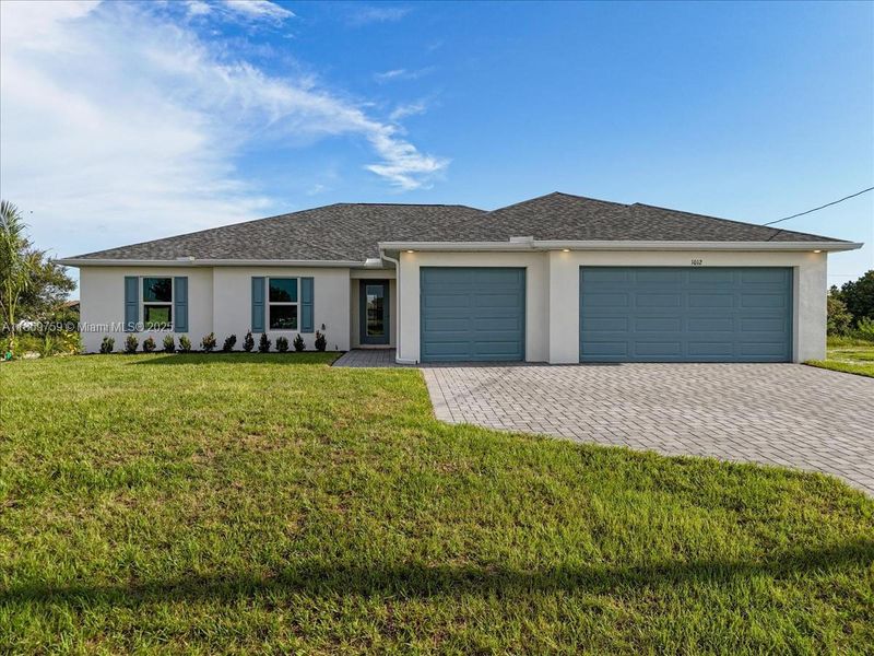Front exterior of a new home in Cape Coral, Cape Coral, FL, highlighting curb appeal (Image 17).